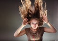 Mysterious enigmatic woman girl with flying hair. Royalty Free Stock Photo