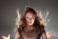 Mysterious enigmatic woman girl with flying hair. Royalty Free Stock Photo