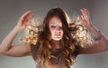 Mysterious enigmatic woman girl with flying hair. Royalty Free Stock Photo