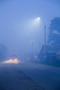 mysterious fog on the street in a small town at night Royalty Free Stock Photo