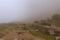 Mysterious foggy landscape of Vrsic Pass. Big rock stone and small trees and bushes. Concept of landscape and nature. Vrsic Pass Royalty Free Stock Photo