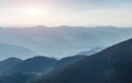 Mysterious Foggy sunrise at Mountains. Awesome Sunny Sammer Landscape under morning Sunlight. Wonderful Nature Background