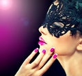 Mysterious girl in carnival mask Royalty Free Stock Photo