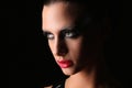 Mysterious girl with makeup. Close up. Gray background