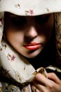 Mysterious girl with shawl hiding eyes. Retouched