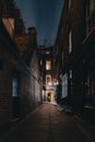 A mysterious and hidden old back alley in London at night Royalty Free Stock Photo