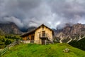 Mysterious landscape of Dolomites Alps with hut and fog. Location: Odle mountain range, Seceda peak in Dolomites Alps, South