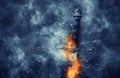 mysterious and magical photo of silver sword with fire flames over gothic snowy black background. Medieval period concept. Royalty Free Stock Photo