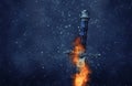 mysterious and magical photo of silver sword with fire flames over gothic snowy black background. Medieval period concept. Royalty Free Stock Photo