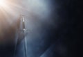 Mysterious and magical photo of silver sword over gothic black background with smoke. Medieval period concept Royalty Free Stock Photo