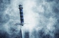 mysterious and magical photo of silver sword over gothic snowy black background. Medieval period concept. Royalty Free Stock Photo