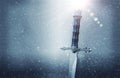 mysterious and magical photo of silver sword over gothic snowy black background. Medieval period concept. Royalty Free Stock Photo