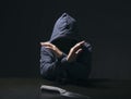 Mysterious man hooded and knife in interrogation room. committed Royalty Free Stock Photo