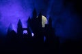 Mysterious medieval castle in a misty full moon. Abandoned gothic style old castle at night Royalty Free Stock Photo