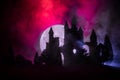 Mysterious medieval castle in a misty full moon. Abandoned gothic style old castle at night Royalty Free Stock Photo