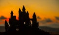 Mysterious medieval castle at sunset. Abandoned gothic style old castle at the evening.