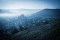 Mysterious misty morning over Biertan village, Transylvania, Romania. Royalty Free Stock Photo