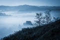 Mysterious misty morning over Biertan village, Transylvania, Romania. Royalty Free Stock Photo