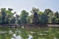 Mysterious, mystical sunken temple ruins in ancient angkor wat, jungle reflecting in lake, cambodia