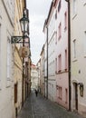 Mysterious narrow alley with lanterns in Prague at night