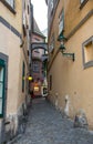 Mysterious narrow alley with lanterns in Prague at night