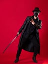 A mysterious ninja assassin in a noir style. A man in black leather clothes Royalty Free Stock Photo