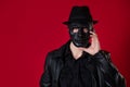 A mysterious ninja assassin in a noir style. A man in black leather clothes Royalty Free Stock Photo