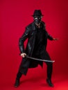 A mysterious ninja assassin in a noir style. A man in black leather clothes Royalty Free Stock Photo