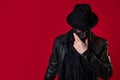 A mysterious ninja assassin in a noir style. A man in black leather clothes Royalty Free Stock Photo