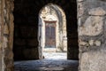 Mysterious old stone archway leading to the entrance of the Motsameta monastery in Imereti, Georgia. Royalty Free Stock Photo
