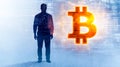 Mysterious programmer standing next to bitcoin symbol over digital code background