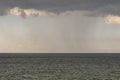 Mysterious rain clouds in the sky and  wavy sea Royalty Free Stock Photo