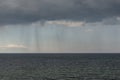 Mysterious rain clouds in the sky and  wavy sea Royalty Free Stock Photo