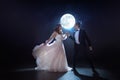 Mysterious and romantic meeting, the bride and groom under the moon. Hugs together. Mixed media Royalty Free Stock Photo