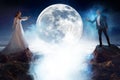 Mysterious and romantic meeting, bride and groom under the moon. Man and woman pulling each other`s hands. Mixed media Royalty Free Stock Photo