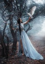 Mysterious sorceress with a bird Royalty Free Stock Photo