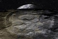 Mysterious surface of the moon with meteorite craters, and the earth rises above the horizon