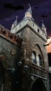 Horrible Halloween. Eerie mysterious view of the dark Gothic town hall with silhouettes of flying bats. Old scary castle or palace