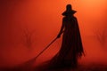 A mysterious witch clad in a floor-length black dress with black hat and broom, she exudes an aura of power and darkness. Red Royalty Free Stock Photo