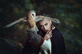 Mysterious woman with barn owl