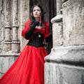 Mysterious woman in red Victorian dress Royalty Free Stock Photo