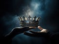mysteriousand magical image of woman& x27;s hand holding a gold crown over gothic black background. Medieval period Royalty Free Stock Photo