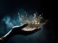 mysteriousand magical image of woman& x27;s hand holding a gold crown over gothic black background. Medieval period Royalty Free Stock Photo