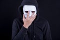 Mystery man wearing white mask for hide his face Royalty Free Stock Photo