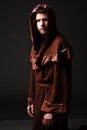 Mystery monk praying on kneels