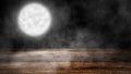 Mystery moon with smoke on wooden tabletop. Mystical night background for design and copyspace