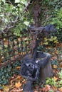 Autumn mystery old Prague Cemetery Olsany with its Statues, Czech Republic