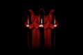 Mystery people in a red hooded cloaks in the dark holding ritual daggers. Royalty Free Stock Photo
