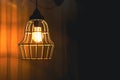 Mystery scene with outdoors sconce lamp in darkness. Dim warm light in dark. Simple classic wall lamp on rough Royalty Free Stock Photo