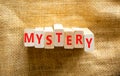 Mystery symbol. The concept word Mystery on wooden blocks. Beautiful canvas background, copy space. Business and mystery Royalty Free Stock Photo